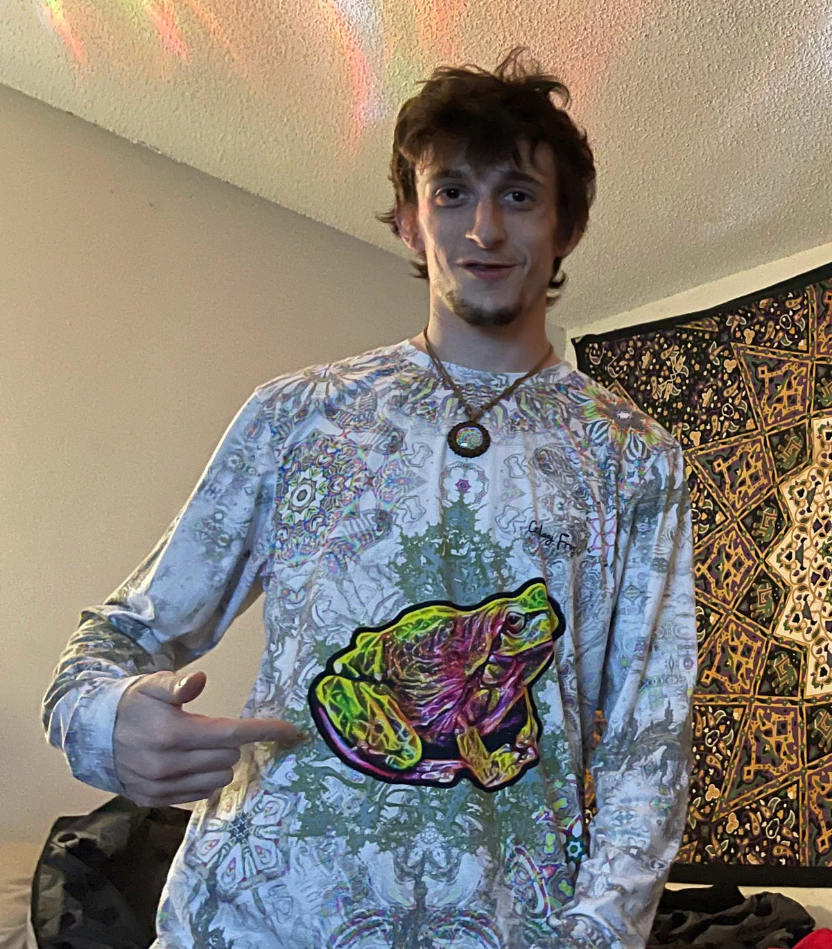A community member wearing Galaxy Frog frog artwork