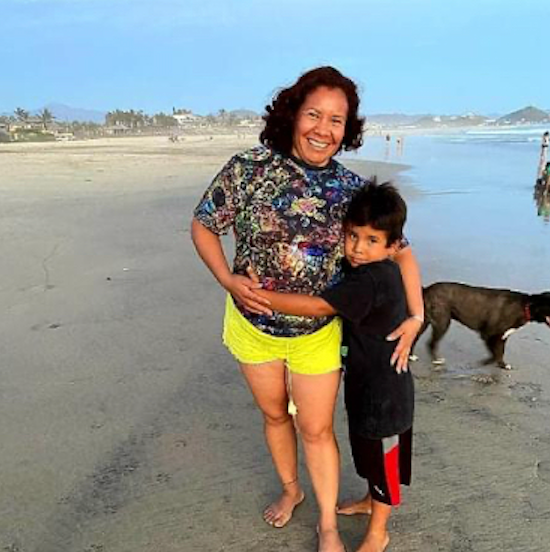 A woman and child wearing Galaxy Frog apparel at the beach